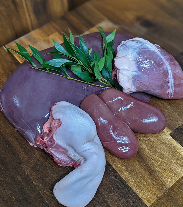 top view of  Venison ( deer) organs (heart, kidneys, tongue, liver)for cats and dogs. Free raned and best for prey model raw diets.